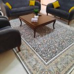 فرش هورام طرح گل افشان زمینه دودی